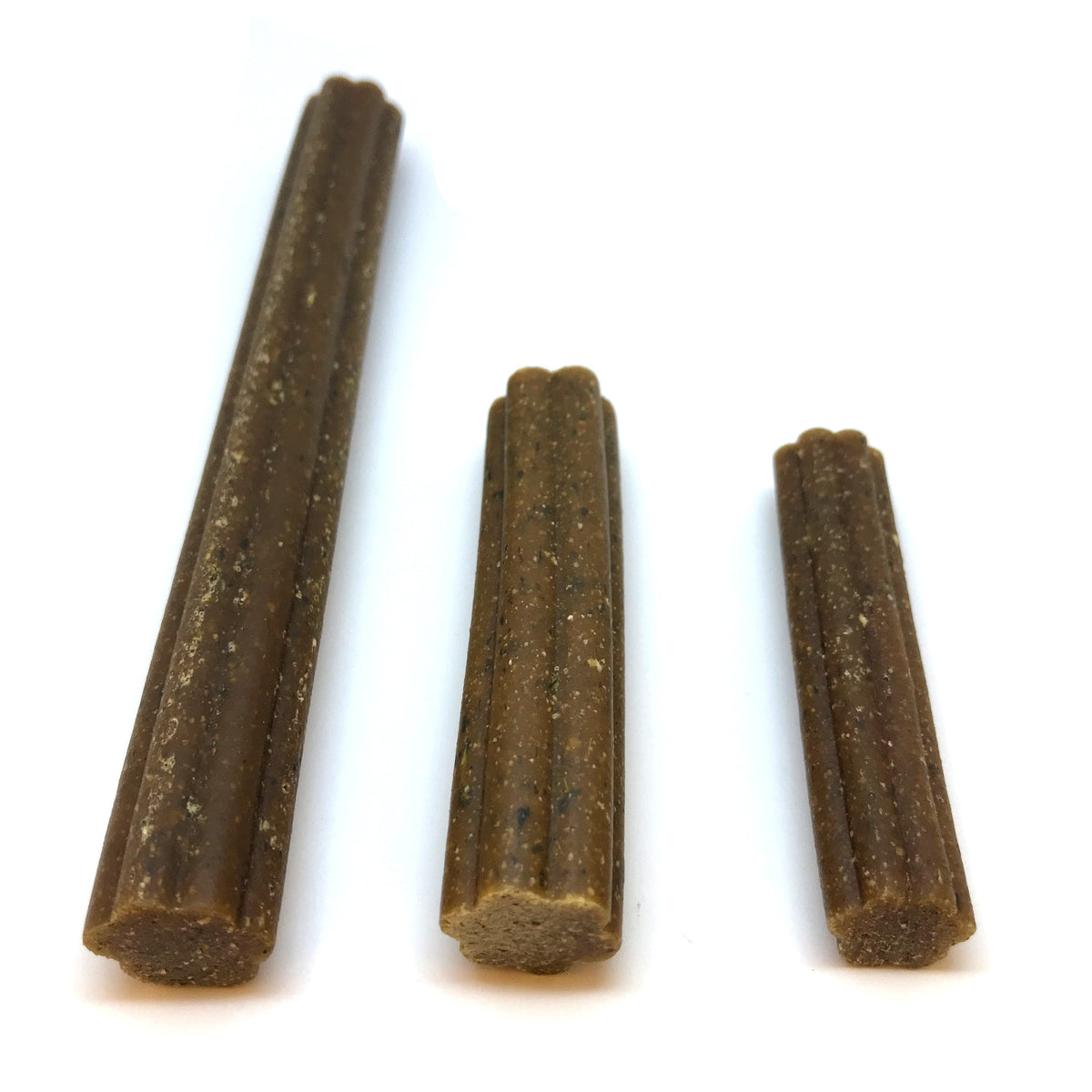 Three brown pet chew sticks, textured surface