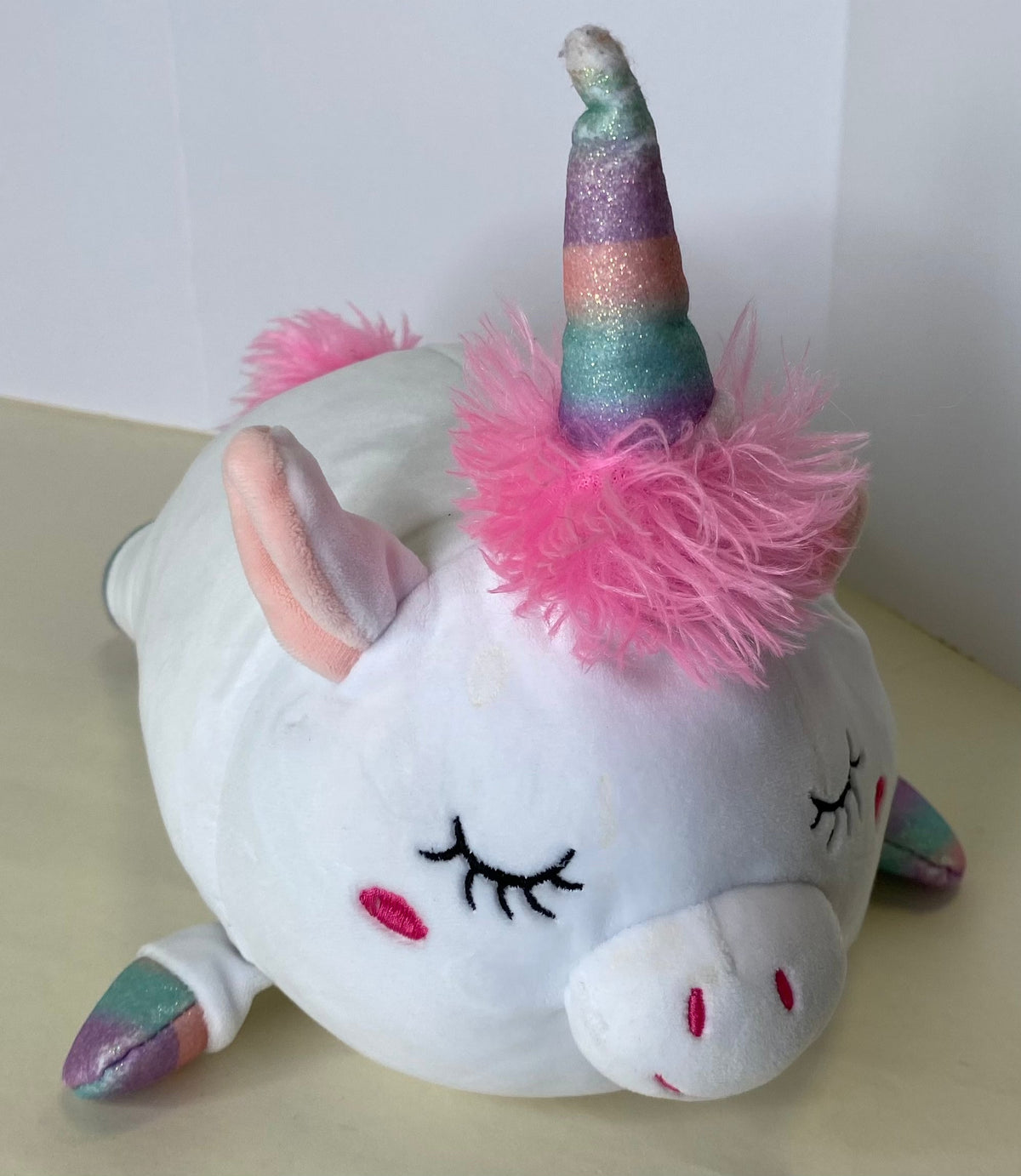 Large white unicorn squishy plush with glitter horn and fluffy pink mane