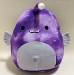 Purple whale plush with smiling face and large gray belly patch