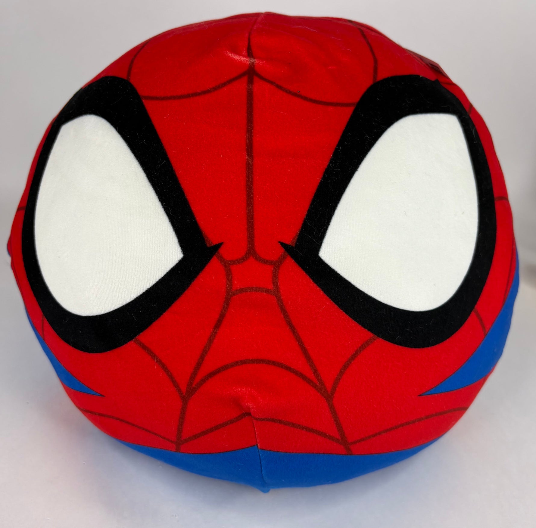 Large squishy plush pet toy, red spider with black eye patches and blue side accents
