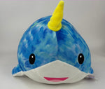 Large squishy plush pet toy, blue and green whale with yellow horn and smiling mouth