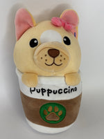Beige dog plush cuddler with pink bow and 'Puppuccino' front patch with paw logo