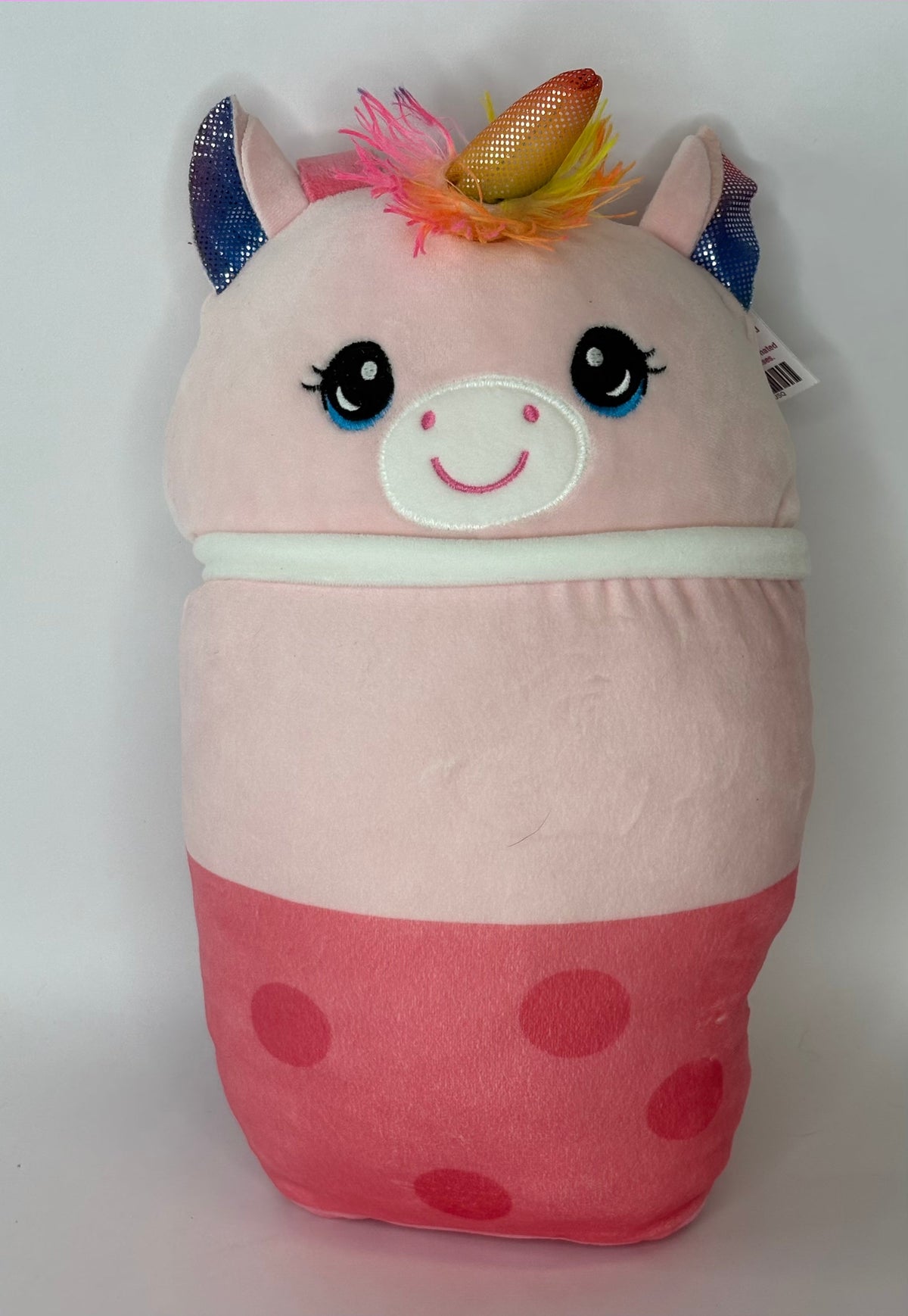 Large pink unicorn-themed plush pet toy with horn and smiling face, squishy pouch