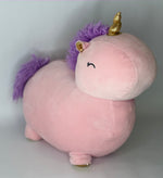 Large pink unicorn plush pet toy with golden horn, small ears, and squishy body