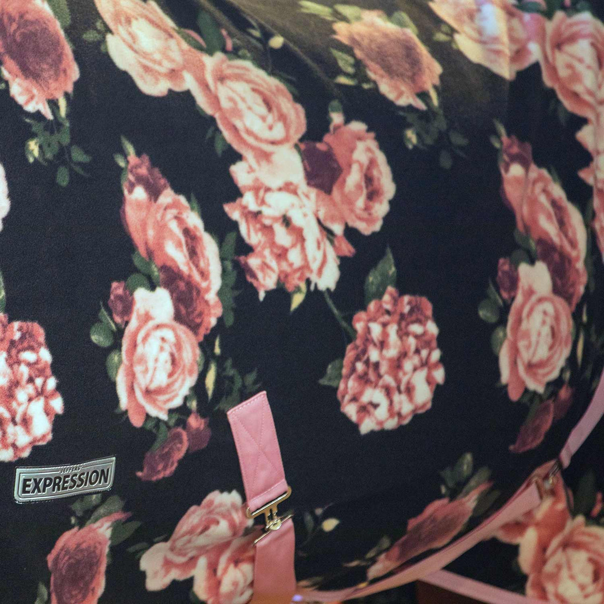 Black fleece fabric with pink rose floral pattern