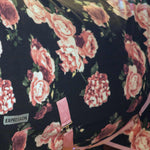 Black fleece fabric with pink rose floral pattern