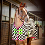 Black-and-white check fleece horse cooler with pink trim and green straps