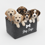 Dark grey felt storage basket with bone logo and handles, filled with dog toys
