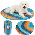 Teal and orange striped travel dog bed with carry pouch and oval base