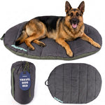 Dark gray travel dog bed with padded cushion and matching carry pouch