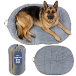 Light gray travel dog bed with padded cushion and matching carry pouch