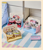Two pet feeding trays side by side with stainless steel bowls on raised platforms