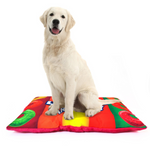 Colorful quilted pet bed mat with red, orange, green graphic pattern