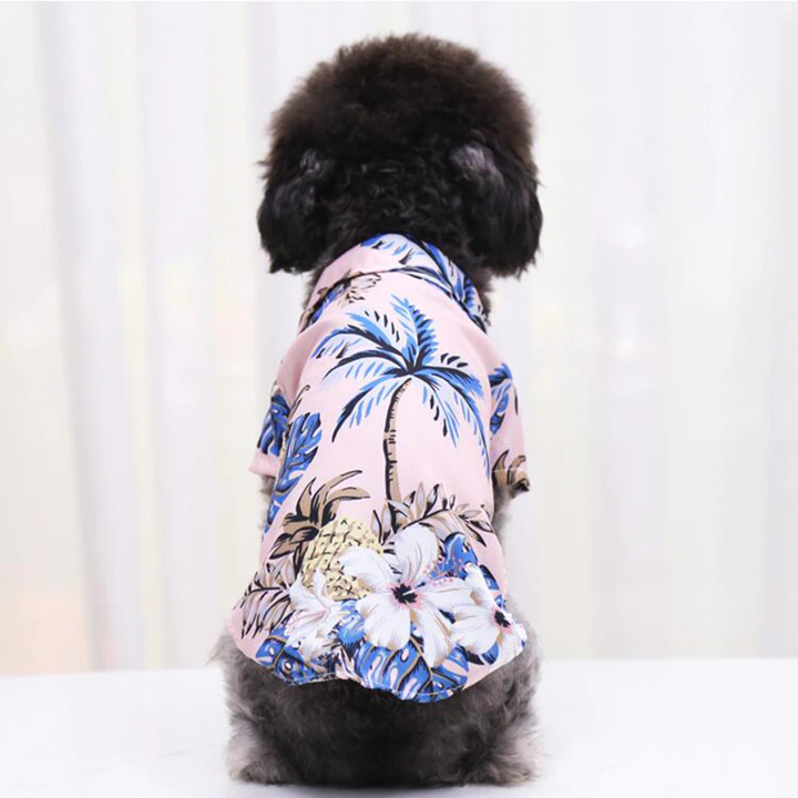 Light pink tropical pet shirt with blue palm leaf pattern and pineapple motifs