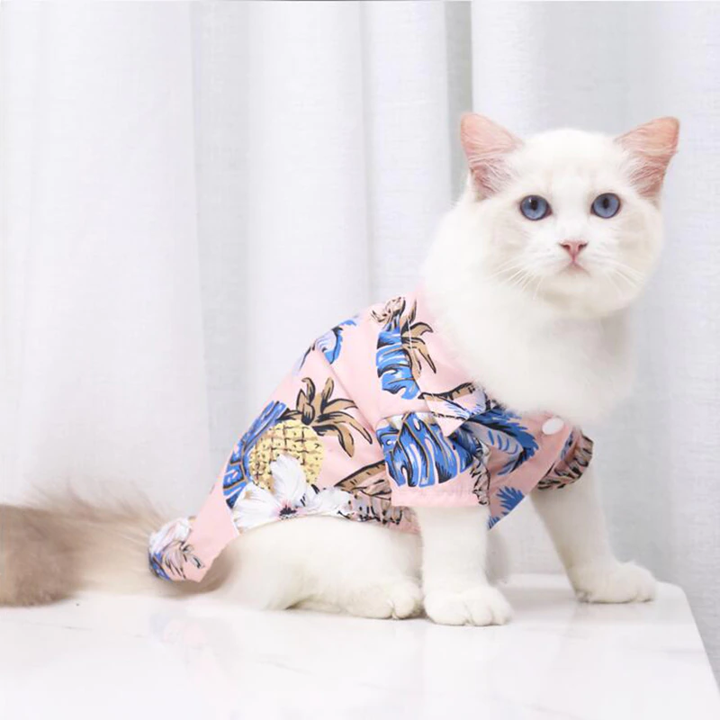 Cream tropical pet shirt with blue palm leaf pattern and pineapple accents