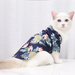 Hawaiian pet shirt in dark navy with colorful pineapple and tropical leaf print