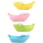 Set of banana-shaped pet beds in yellow, pink, and lime green with plush cushions