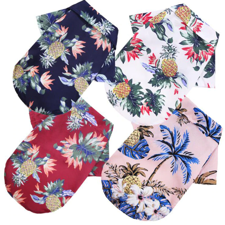 Tropical pineapple print pet shirts in navy, white, and pink with short sleeves
