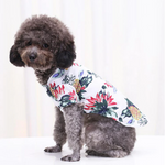 Hawaiian pet shirt in white with red, blue, and green tropical leaf print