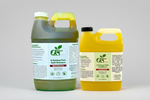 Pet shampoo and conditioner set with green and yellow jugs on a clean studio setup.