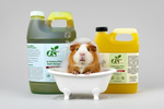 Pet shampoo and conditioner bottles in plastic jugs, green and yellow, with pump tops.
