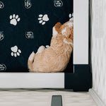 Black paw print pet mat on floor with quilted diamond pattern