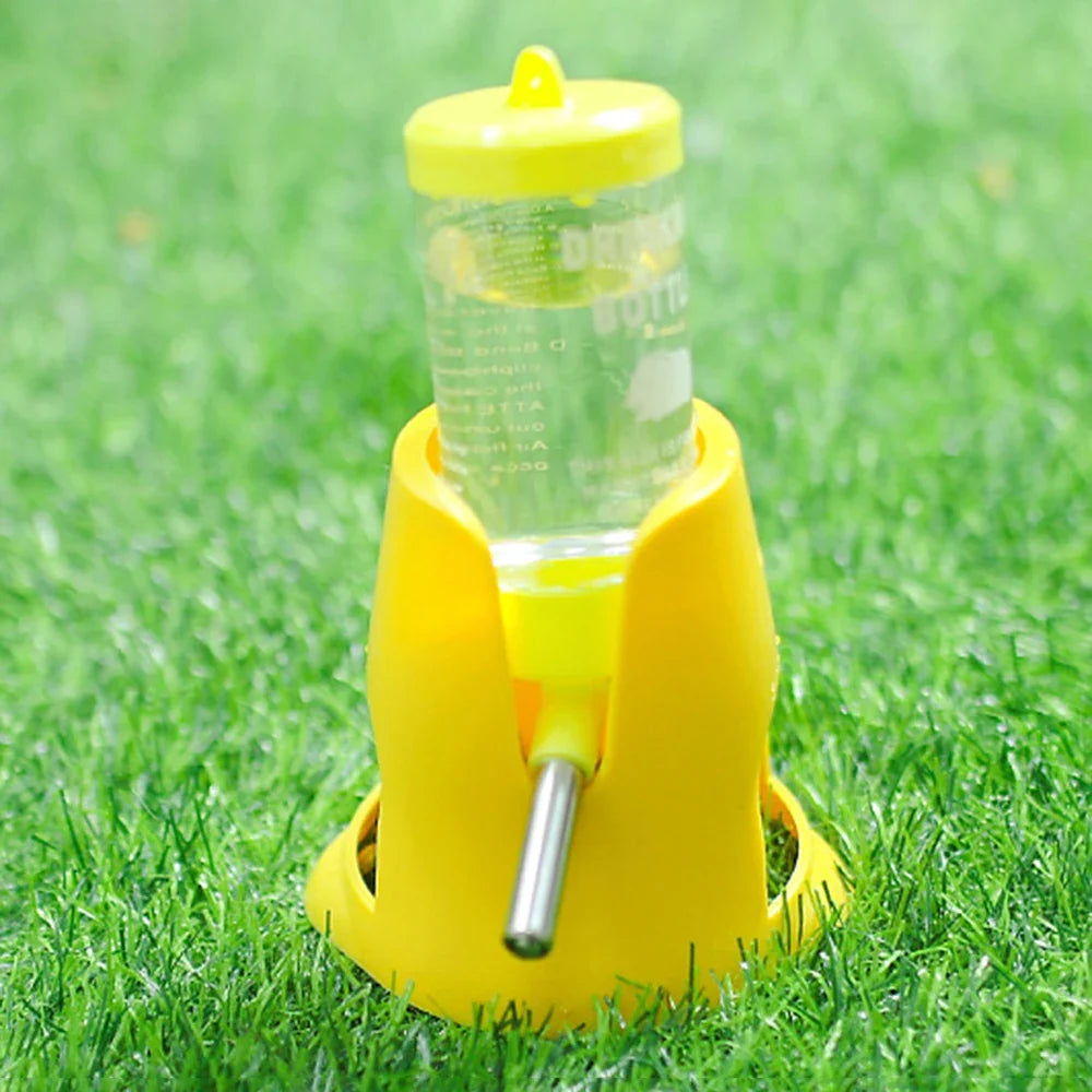 Yellow automatic pet water bottle feeder dispenser with clear bottle and metal drinking tube