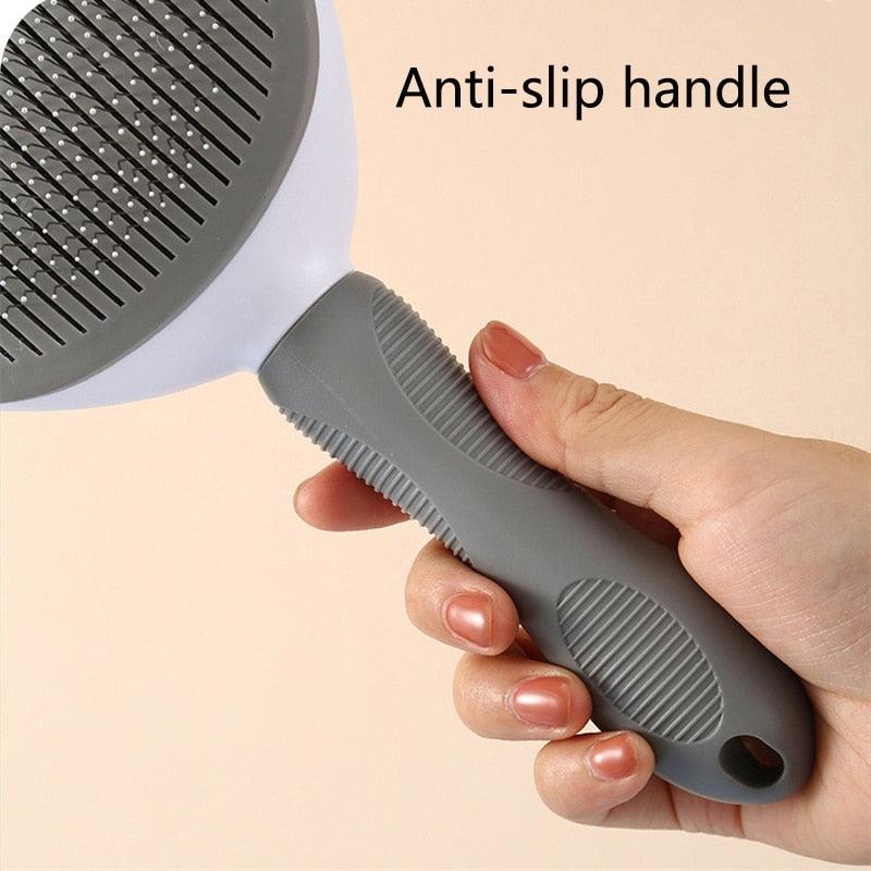 Pet hair remover brush with gray anti-slip handle and oval pin head
