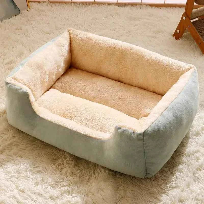 Light blue and cream plush pet bed with thick cushioned sides and base
