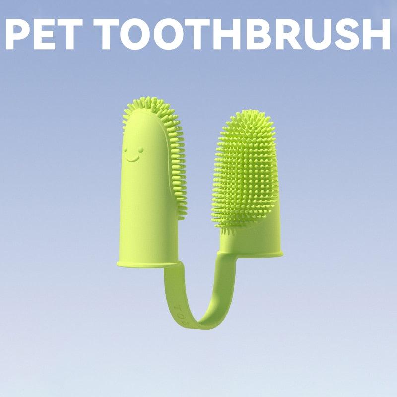 Light green silicone pet finger toothbrush with textured cleaning nubs on two finger sleeves.