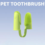 Light green silicone pet finger toothbrush with textured cleaning nubs on two finger sleeves.