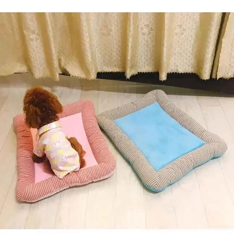 Two pet cooling mats: pink and light blue with gray-striped borders