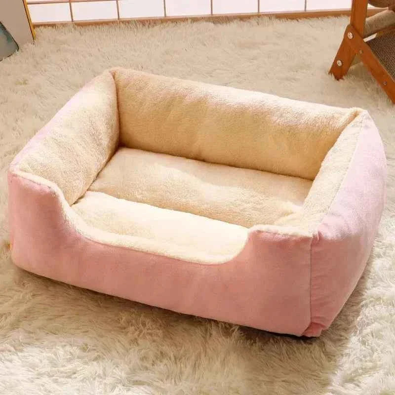 Pink and cream plush pet bed with thick cushioned sides and base