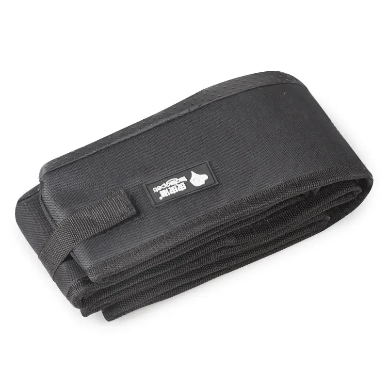 Folded portable pet litter box with dark fabric cover and carrying strap