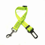 Neon green pet car safety belt harness with adjustable clip and metal D-rings.