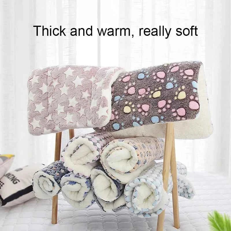Flannel pet sleeping mat, pink and dark blue folded rolls with plush star-and-foot designs
