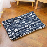 Navy flannel pet sleeping mat with white cat pattern and cushioned foldable design