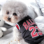 Black basketball pet jersey with red “BALLS 24” number print and striped collar