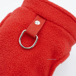 Red fleece dog vest detail with D-ring leash ring and fabric tab