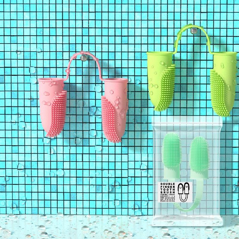 Silicone double finger toothbrush set with mint, yellow, and pink brushes
