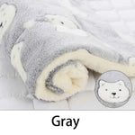 Gray flannel pet sleeping mat with paw-print design and circular animal face applique