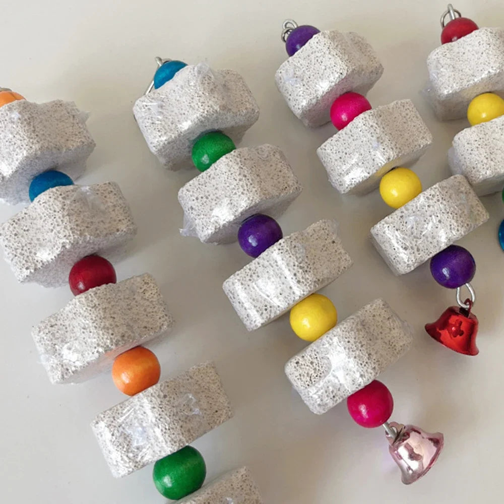 Volcanic rock chew toy with stacked cubes and colorful beads, with small bell charms