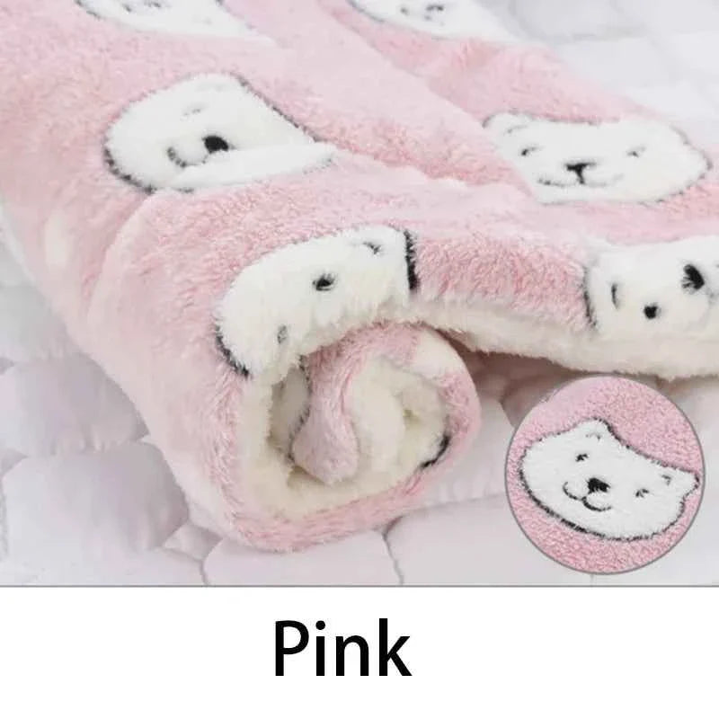 Pink flannel pet sleeping mat, close-up of plush rolled edge with cute animal patches