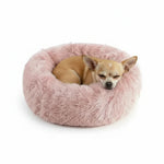 Plush round donut pet bed, blush pink shag cushion with sleeping small dog
