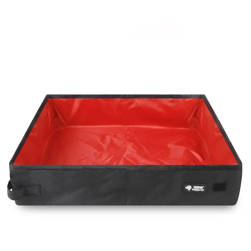 Portable folding pet litter box with dark fabric sides and red waterproof liner