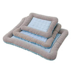 Stacked pet cooling mats with light blue textured insert and gray striped sides
