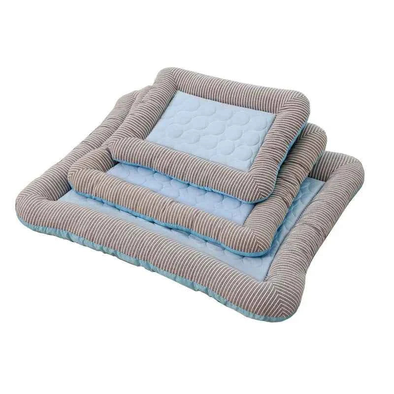 Stacked pet cooling mats with light blue textured insert and gray striped sides