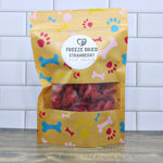 Freeze-dried strawberry dog treats in gold pouch bag with paw print pattern