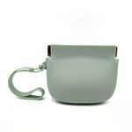 Mint-green silicone treat training pouch with wrist strap and snap clasp closure.