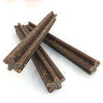 Dark brown speckled chew sticks, pumpkin-flavored dog treats
